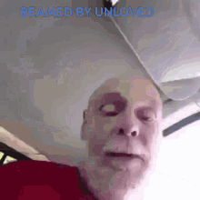 a man with a beard is being beamed by someone