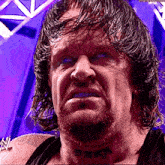 a wrestler with a tattoo on his neck that says ' smack '