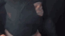 a close up of a person 's butt in a black shirt .