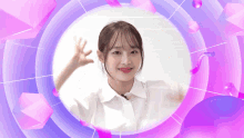 a woman in a white shirt is waving her hand in front of a pink and purple background