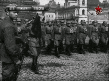 a black and white photo of soldiers marching with the date march 19 1915 visible