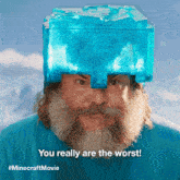 a man with a beard is wearing a blue ice cube on his head