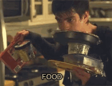 a man is pouring food into a bowl and the word food is on the bottom