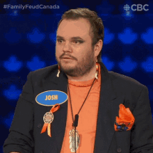 a man wearing a name tag that says josh on it