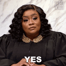 a woman in a judge 's gown says yes