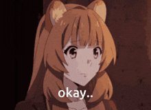 a girl with a cat ear and the word okay on her face