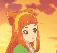 a girl with orange hair and a yellow headband looks surprised