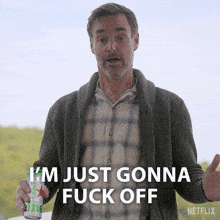 a man is holding a can of diet heineken and says i 'm just gonna fuck off