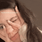 a woman covering her face with her hand with the words boredom is the root of all evil written above her
