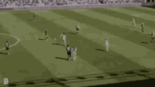 a group of soccer players are playing on a field .