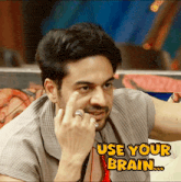 a man with a ring on his finger and the words use your brain on the bottom