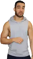 a man with a beard wearing a grey tank top