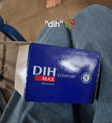 a person is holding a box of dih comfort diosminum