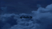 a dark blue background with a few lights on the bottom