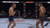 two men are fighting in a boxing ring with a monster energy ad behind them