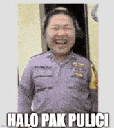 a woman in a police uniform is laughing and has the words halo pak pulici written below her .