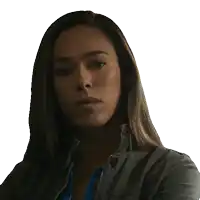 a woman with a serious look on her face is wearing a jacket