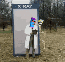 a man standing in front of an x-ray booth