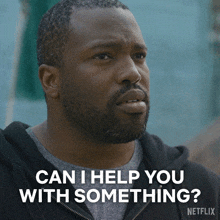a man with a beard is asking if he can help you with something