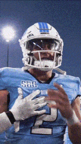 a football player wearing a blue uniform with the number 2 on it