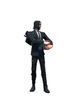a man in a suit holding a bowl of popcorn