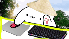 a cartoon character wearing a straw hat is next to a keyboard