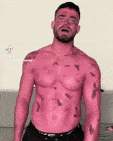 a shirtless man with red paint on his face and body has a tiktok account