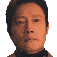a close up of a man 's face with his eyes closed