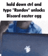 a man is sitting in front of a laptop with the words hold down ctrl and type rondov