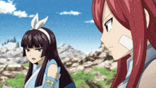 a girl with a bandage on her face looks at another girl