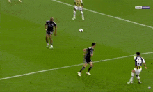 soccer players on a field with one wearing a number 23 jersey