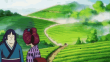 a man and a woman are standing in a field of green plants