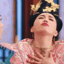 a woman in a traditional costume is making a funny face .