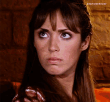 a close up of a woman 's face with the hashtag anahioverdose below her