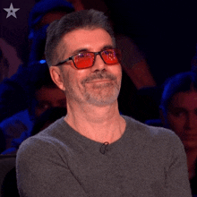 Chuckle Simon Cowell GIF - Chuckle Simon Cowell Britain'S Got Talent GIFs