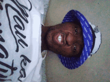 a man wearing a white shirt that says " love you " on it