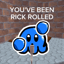 a picture of a blue cartoon character with the words " you 've been rick rolled " above it