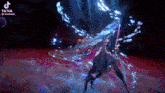 a tiktok video of a person holding a sword in a dark room .