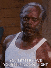 a man with a beard and mustache is wearing a white tank top and says `` you better have yourself a goodnight '' .