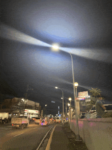 a busy street at night with a sign that says risk on it
