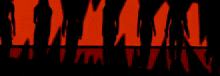 a group of people are standing in front of a red background and their shadows are visible .