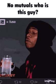 a man in a black hoodie is holding a glass of water and the caption reads no mutuals who is this guy