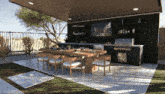an outdoor kitchen with a table and chairs and a grill