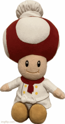 a stuffed mushroom is wearing a chef 's outfit and hat