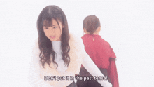 a girl says " don 't put it in the past tense " in front of another girl