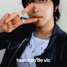 a close up of a person 's face with the words haechan 'de vic in the corner