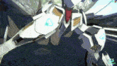 a video game screen shows a white robot with a blue triangle on its chest