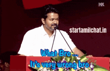 a man speaking into a microphone with the words what bro it 's very wrong bro below him