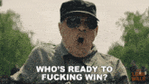 a man wearing sunglasses and a hat is asking who 's ready to fucking win