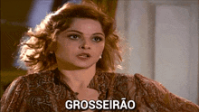 a woman in a paisley blouse says grosseirao